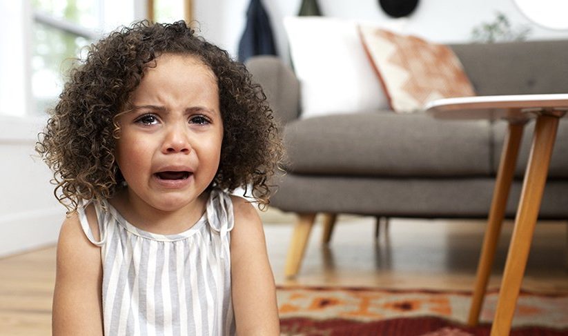 Young child crying and upset